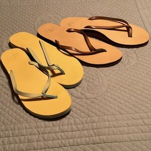 Two Pairs of Flip Flops in Yellow, Brown, and Tan